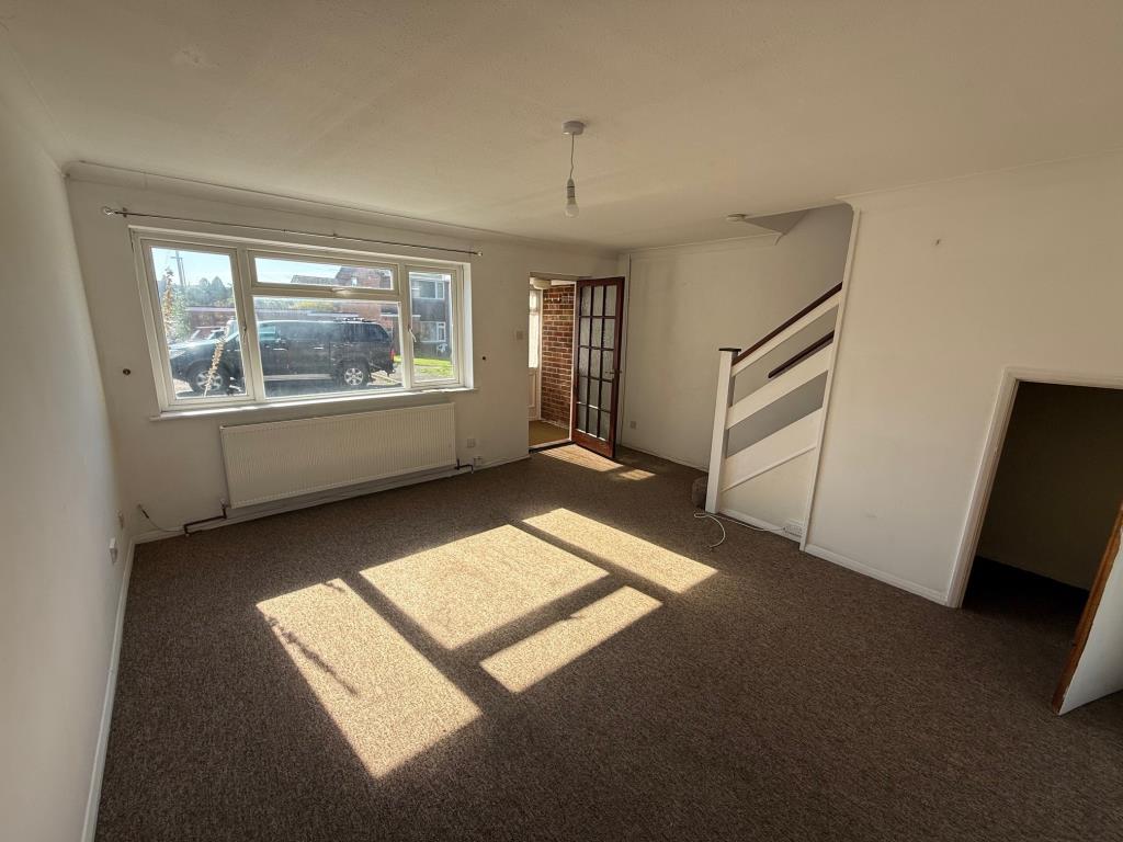 Lot: 161 - THREE-BEDROOM HOUSE WITH GARAGE - Living room looking towards the front window
